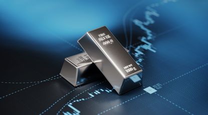 Silver Bars Sitting on Blue Bar Graph