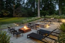 outdoor patio area with lighting and firepit