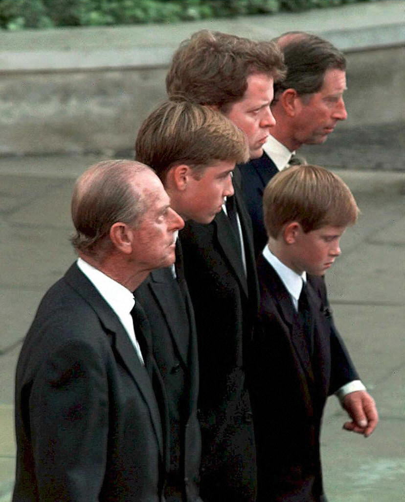 Prince Philip, Prince William, Earl Charles Spencer, Prince Harry, and King Charles walk together behind the carriage carrying the casket of Princess Diana on its way to the funeral
