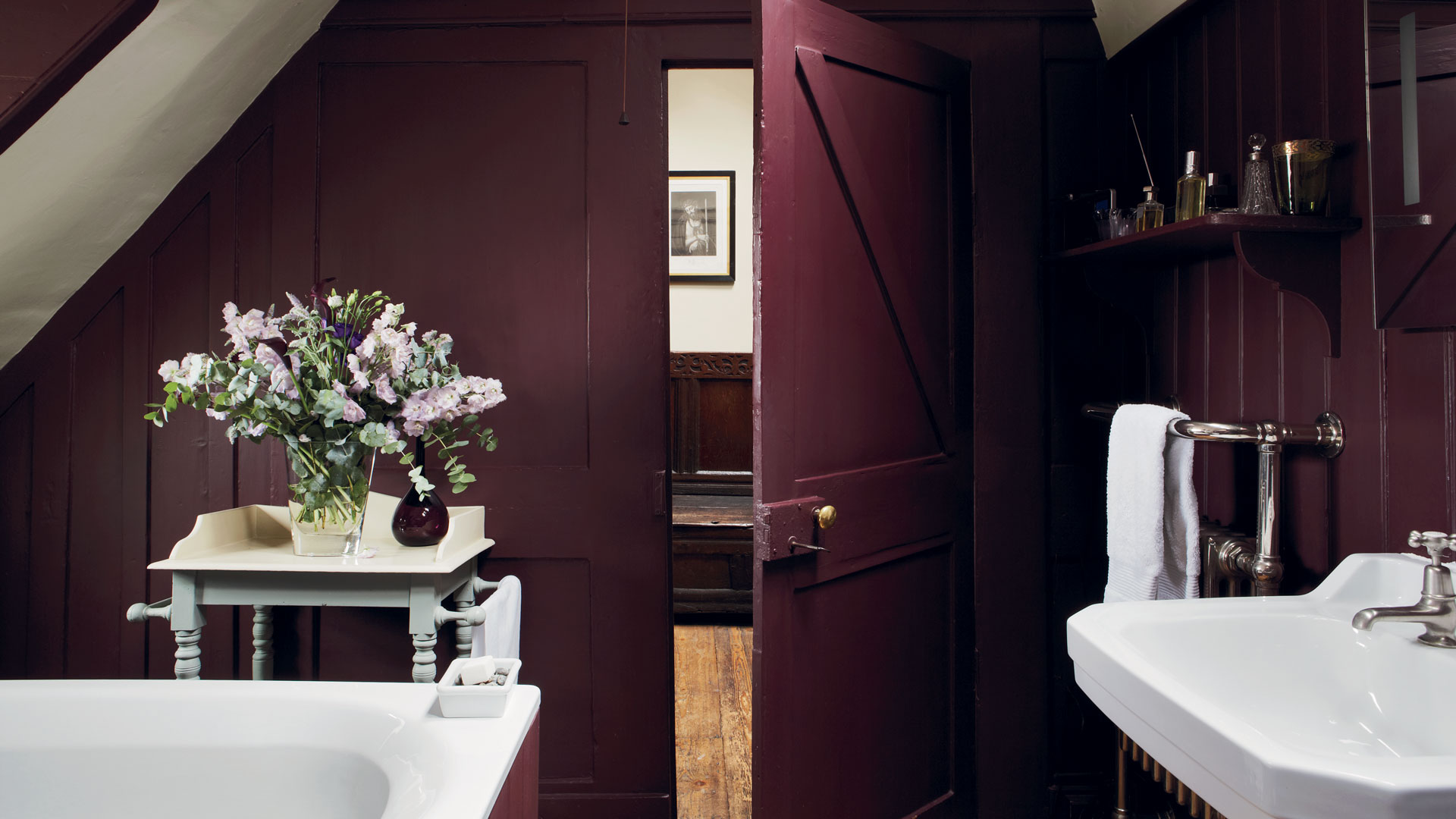burgundy bathroom with white basin