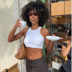 women in white cropped top and pants