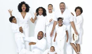 Black-ish the Johnson family smiling against a white background