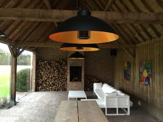 Overhanging patio heater in open barn