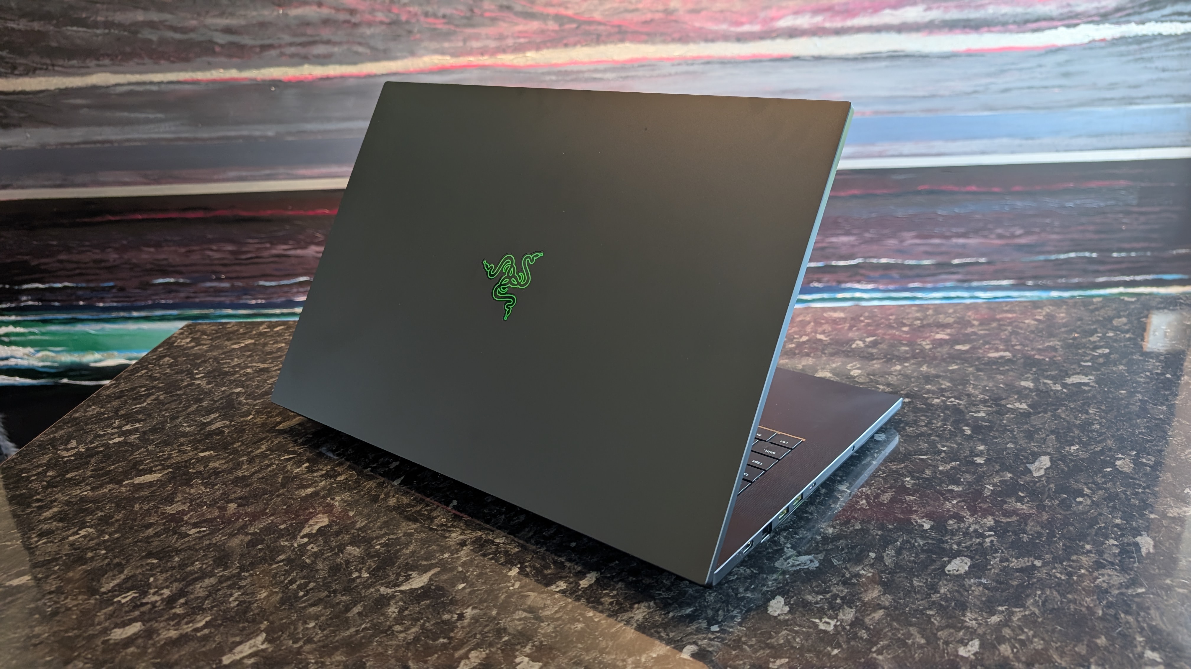 The Razer Blade 18 (2026) pictured on a black marble worktop.