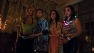The cast of Bodies Bodies Bodies, bloodied and wearing neon necklaces