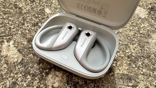 The 1More S50 earbuds in their charging case