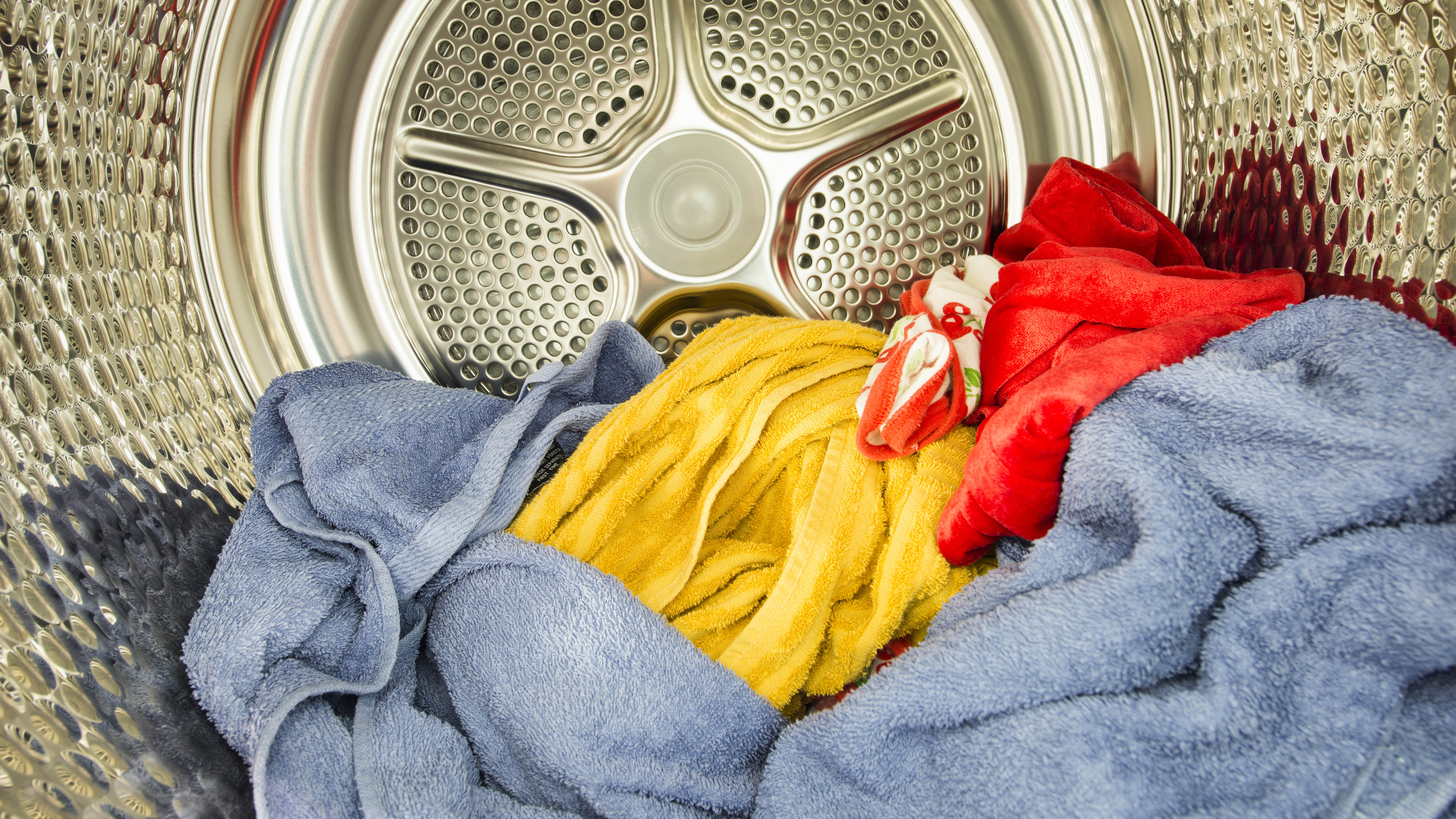 Inside the clothes dryer is full of laundry