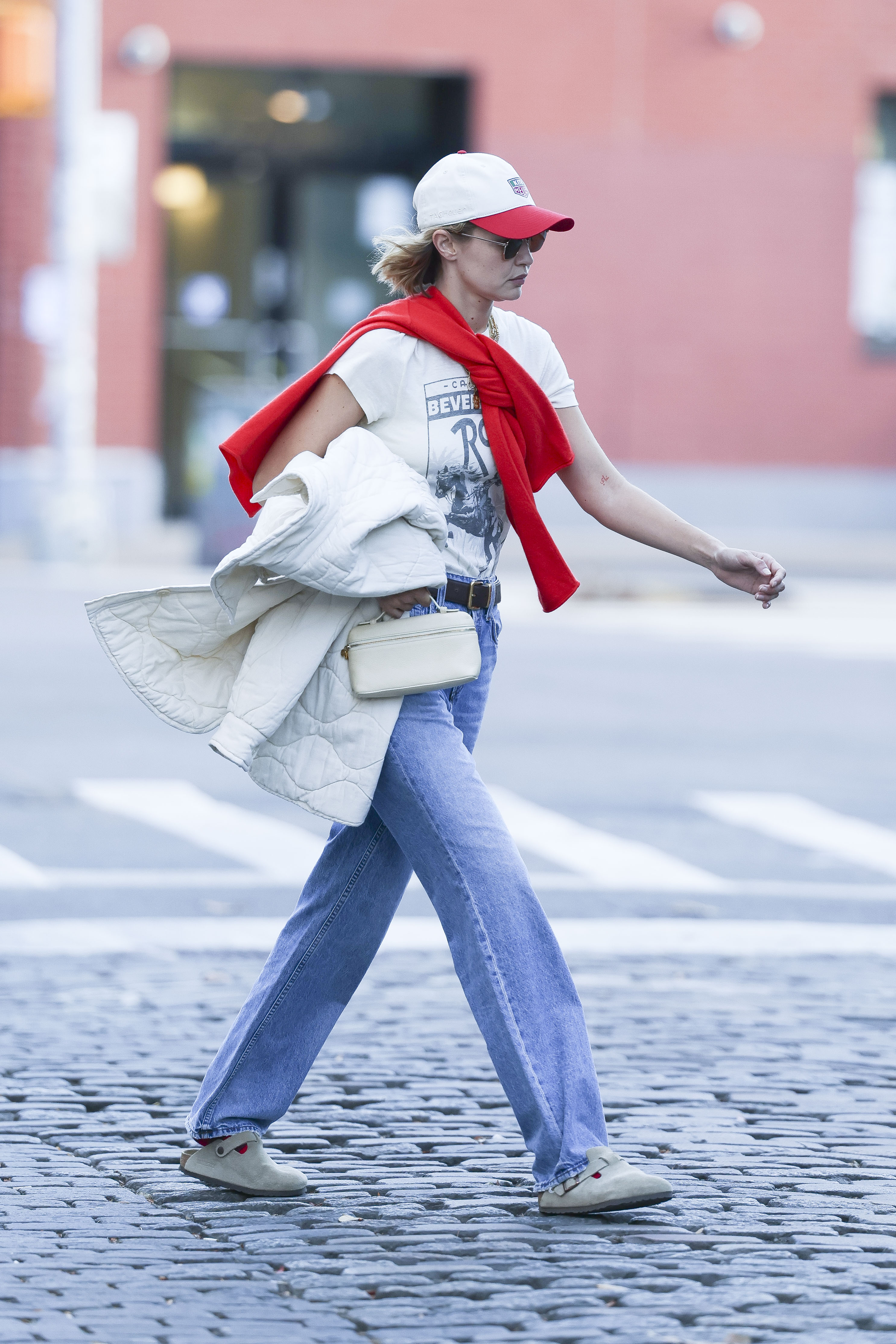 Gigi Hadid wears jeans and clogs