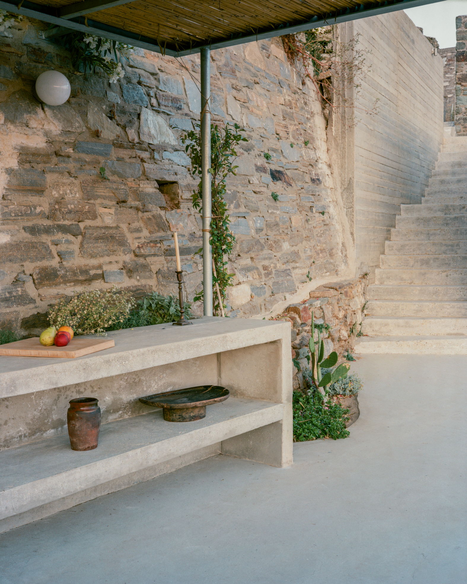 view of a Tinos house, using local vernacular such as stone walls and contemporary design