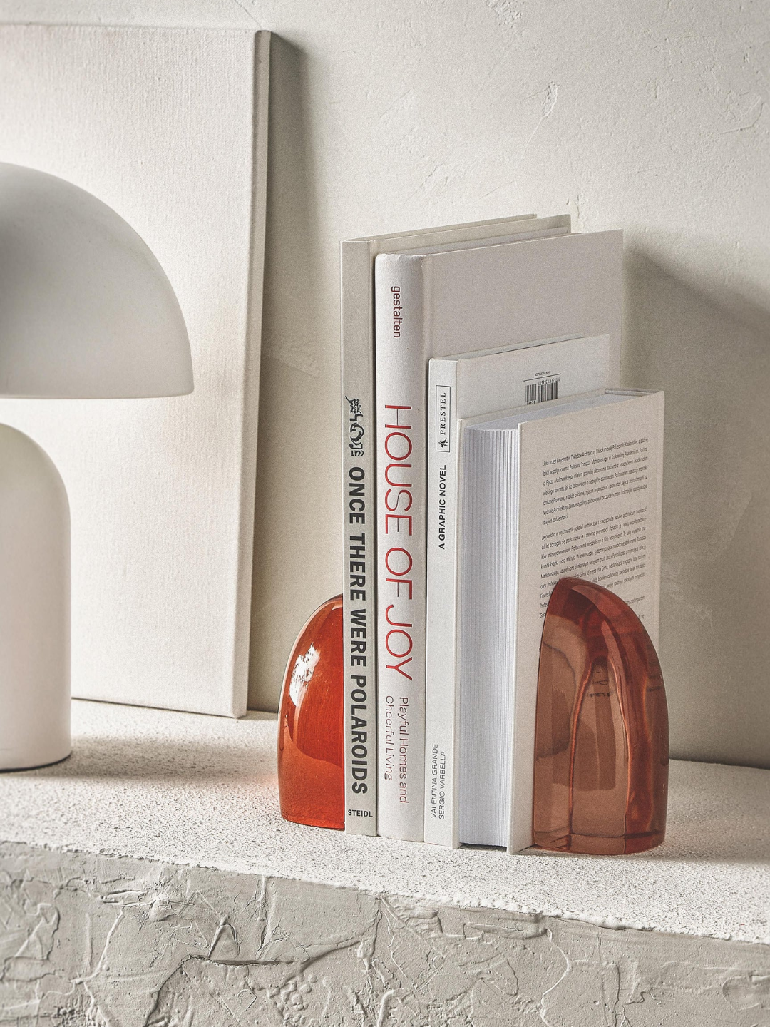 A pair of coral translucent bookends from Westwing