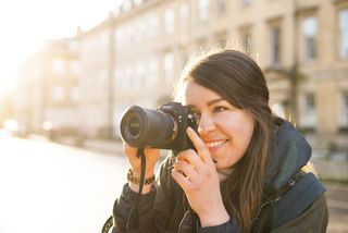 Lauren Scott using Sony A7 III camera on the street