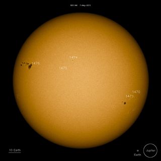 The monster sunspot group AR 1476 (upper left) measures more than 60,000 miles from end to end. NASA's Solar Dynamics Observatory spacecraft snapped this photo on May 7, 2012.