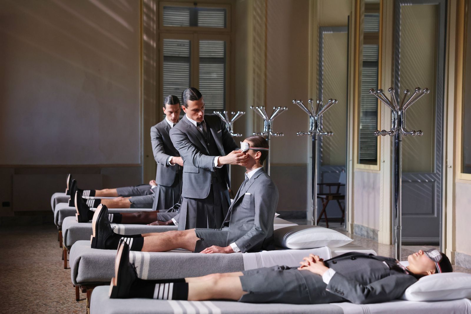 Thom Browne models on beds