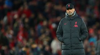 Liverpool manager Jurgen Klopp looks downcast during the UEFA Champions League round of 16 first leg match between Liverpool and Real Madrid at Anfield on 21 February, 2023 in Liverpool, United Kingdom.