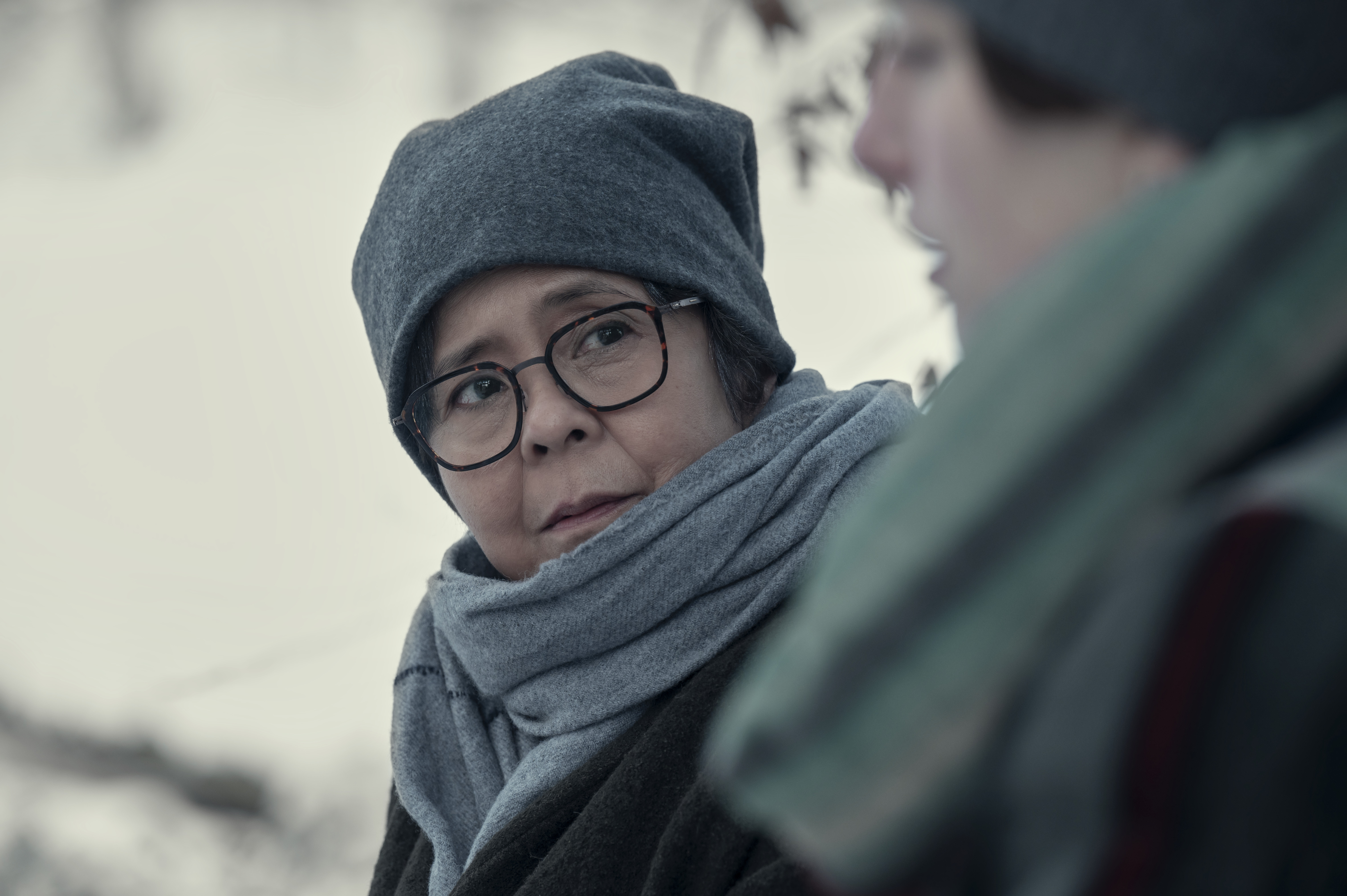 dolly de leon as agnes the nun bundled outside in the snow in nine perfect strangers season 2