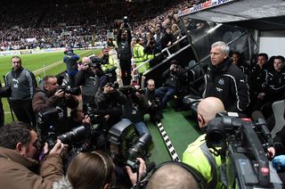 Alan Pardew surrounded by cameras in his first game in charge of Newcastle