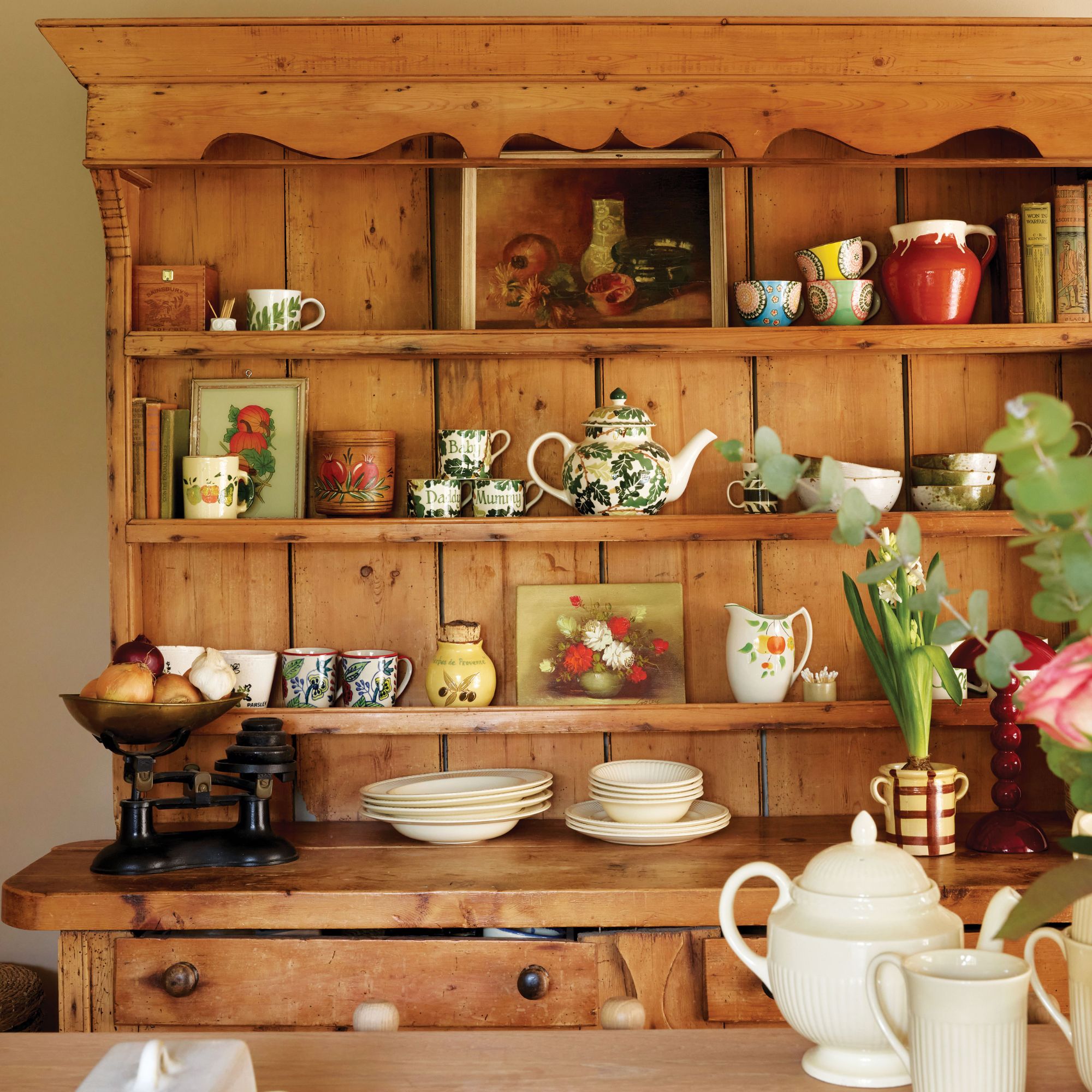 Wooden kitchen cabinet with antiques displayed
