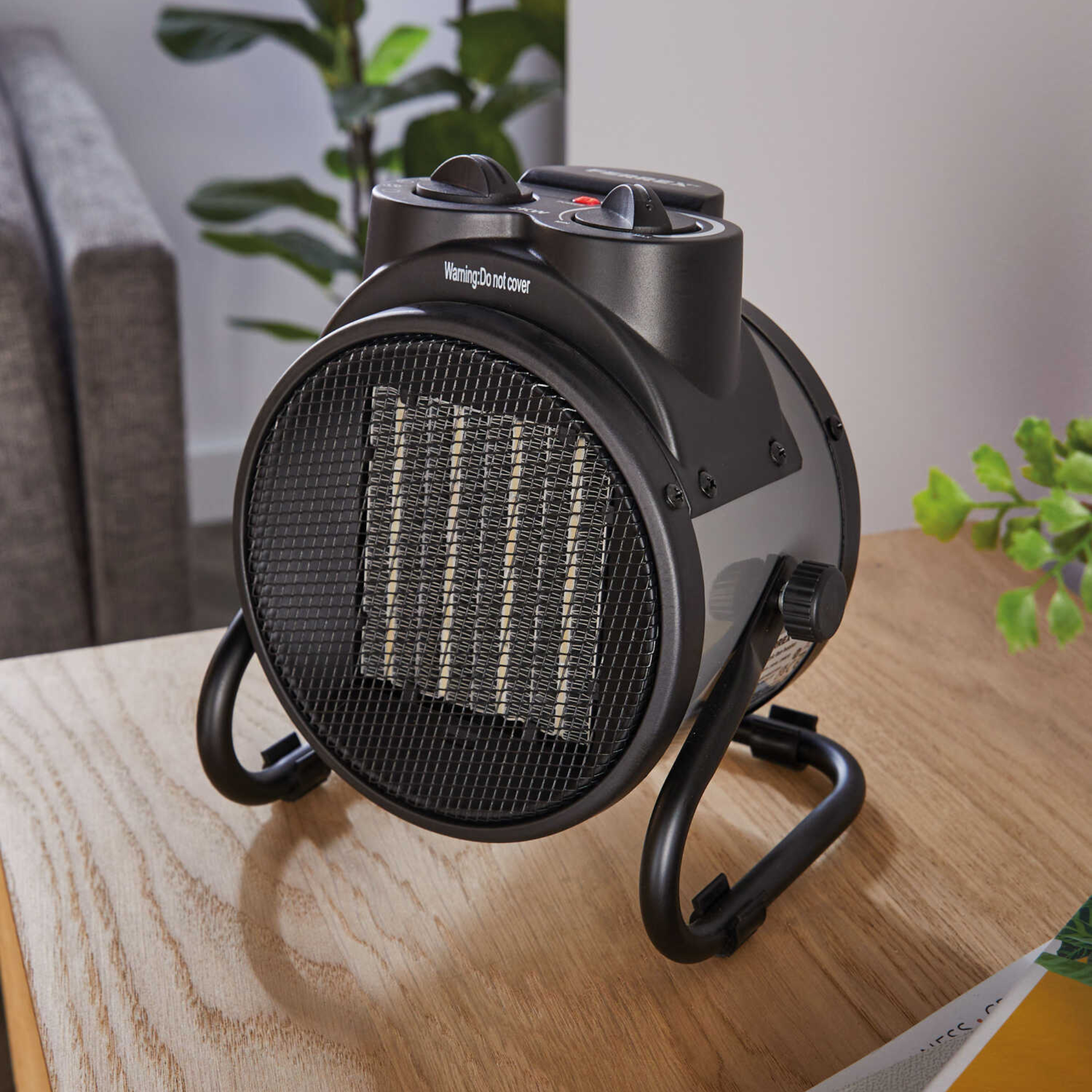 Aldi electric fan heater on tabletop