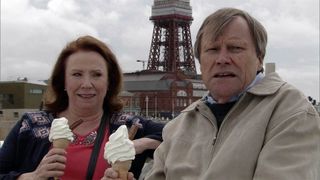 Cathy Matthews and Roy Cropper eat ice cream at the beach