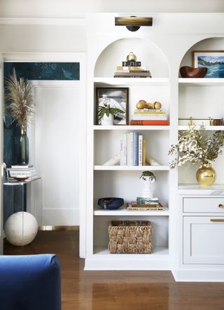 Living room shelving in curved alcoves