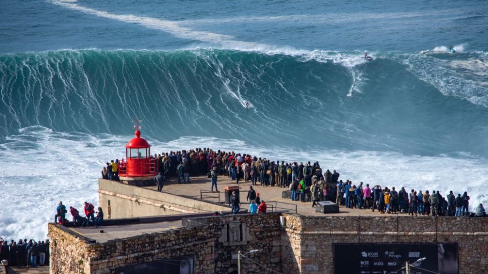 Spectators gather at a viewing platform in Nazaré to watch big-wave surfing.