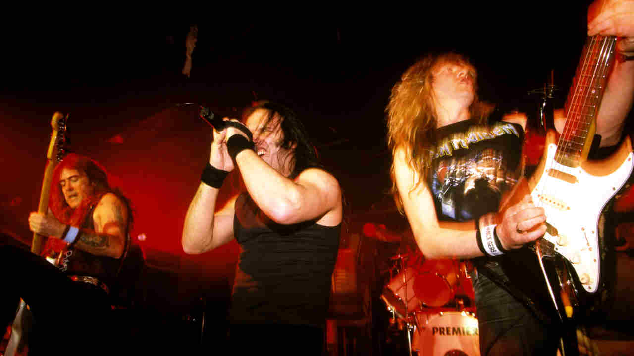 Blaze Bayley performing onstage with Iron Maiden in the 1990s