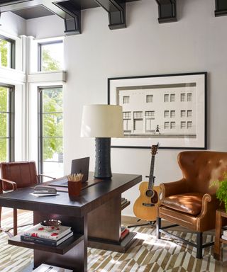 Living room with armchairs and guitar
