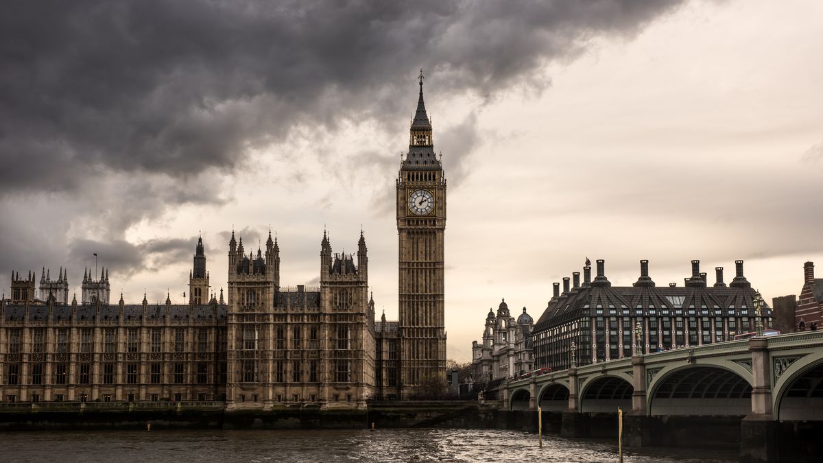 Houses of Parliament in London with bank of grey clouds above