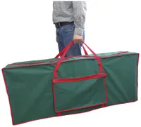 A dark green Christmas tree storage bag with red detail and reinforced handle