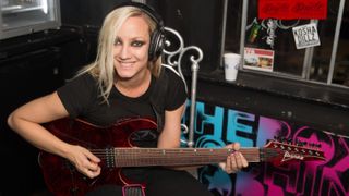 Guitarist Nita Strauss of Consume The Fire poses backstage at The Roxy Theatre on April 1, 2013 in West Hollywood, California.