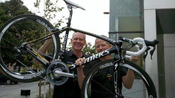 Mike Sinyard and Bob Stapleton show off one of the bikes HTC-Highroad's men's squad will use in 2011.