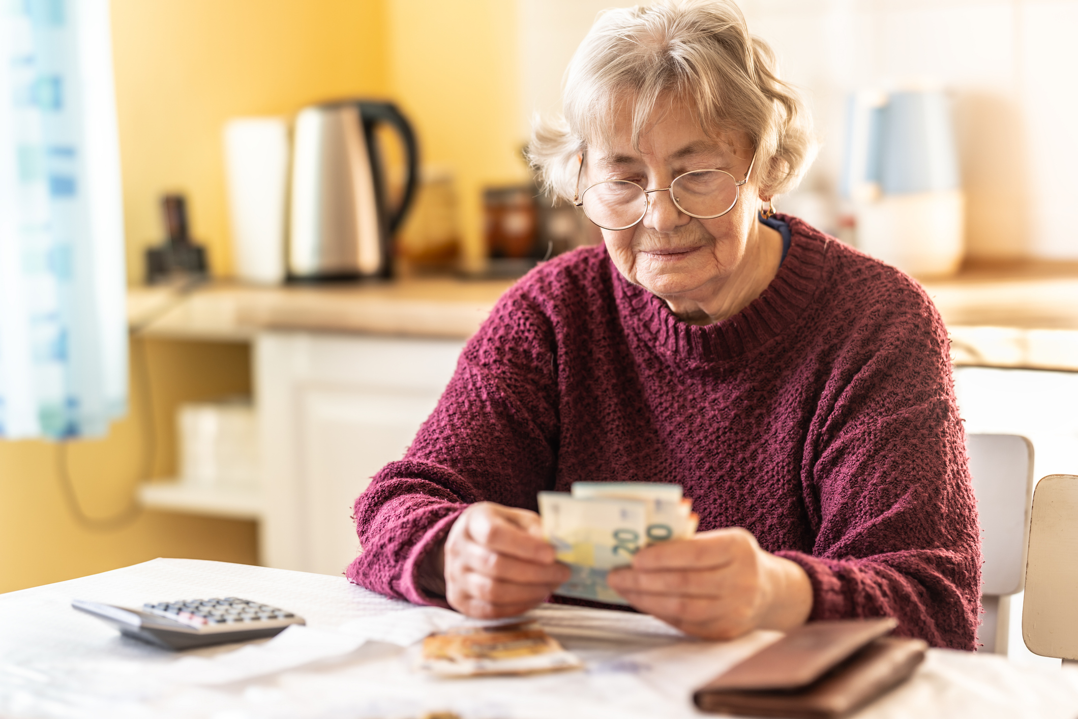 Older woman counting money