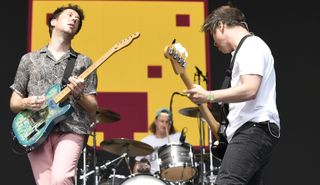 (from left) Matthew Murphy, Dan Haggis and Tord Øverland Knudsen of The Wombats perform at Lollapalooza 2022 at Grant Park on July 28, 2022 in Chicago, Illinois