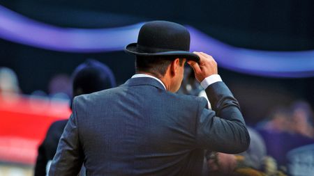 A HOYS judge from behind wearing a bowler hat and a smart suit.