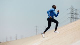 Man doing hill interval session to increase running speed