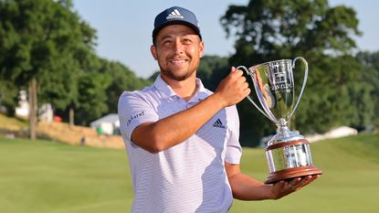 Xander Schauffele with the trophy after winning the 2022 Travelers Championship at TPC River Highlands