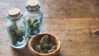 Close-Up Of Marijuana In Jar On Table