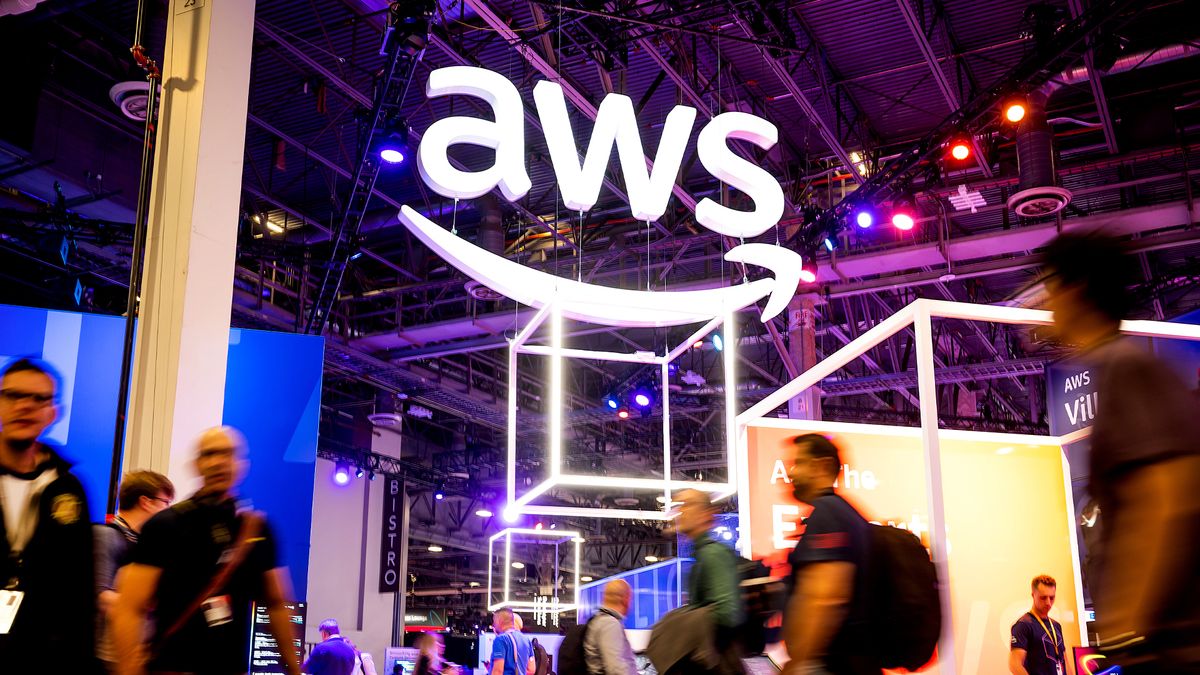 Attendees walk through an expo hall during AWS re:Invent 2022, a conference hosted by Amazon Web Services, at The Venetian Las Vegas on November 29, 2022 in Las Vegas, Nevada.