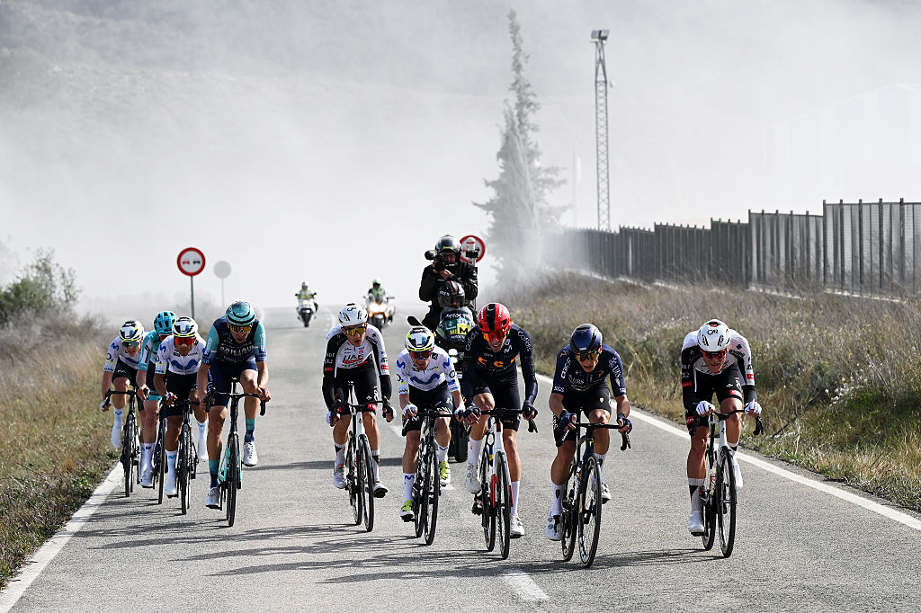 YECLA, SPAIN - FEBRUARY 13: (L-R) Juan Pedro Lopez of Spain, Raul Garcia Pierna of Spain, Jefferson Alveiro Cepeda of Ecuador and Team Movistar, Kamil Gradek of Poland and Team Bahrain - Victorious, Marc Soler of Spain and UAE Team Emirates - XRG, Jefferson Alveiro Cepeda of Ecuador and Team Movistar, Marc Soler of Spain and UAE Team Emirates - XRG, Quinten Hermans of Belgium and Team Pinarello Q36.5 Pro Cycling and Hector Alvarez of Spain and Team Spain compete in the breakaway during the 46th Vuelta a la Region de Murcia 2026, Stage 1 a 83.5km stage from Fortuna to Yecla 598m / The race has been neutralized due to strong winds and will resume again at 2pm from the town of Fortuna / on February 13, 2026 in Yecla, Spain. (Photo by Dario Belingheri/Getty Images)