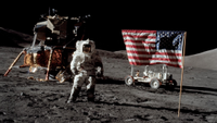 a NASA astronaut on the moon beside the American flag