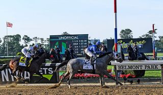 Jockey Luis Saez riding Essential Quality crosses the finish line to win the 153rd Belmont Stakes at Belmont Park in Elmont, New York on June 5, 2021.