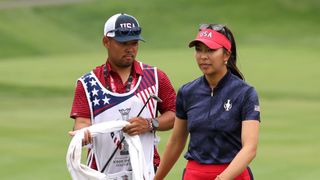 Alison Lee and her caddie on day one of the Solheim Cup