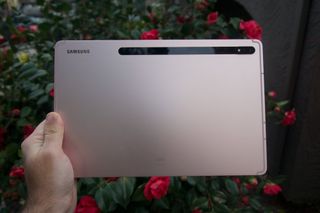 The Samsung Galaxy Tab S8+ held in one hand