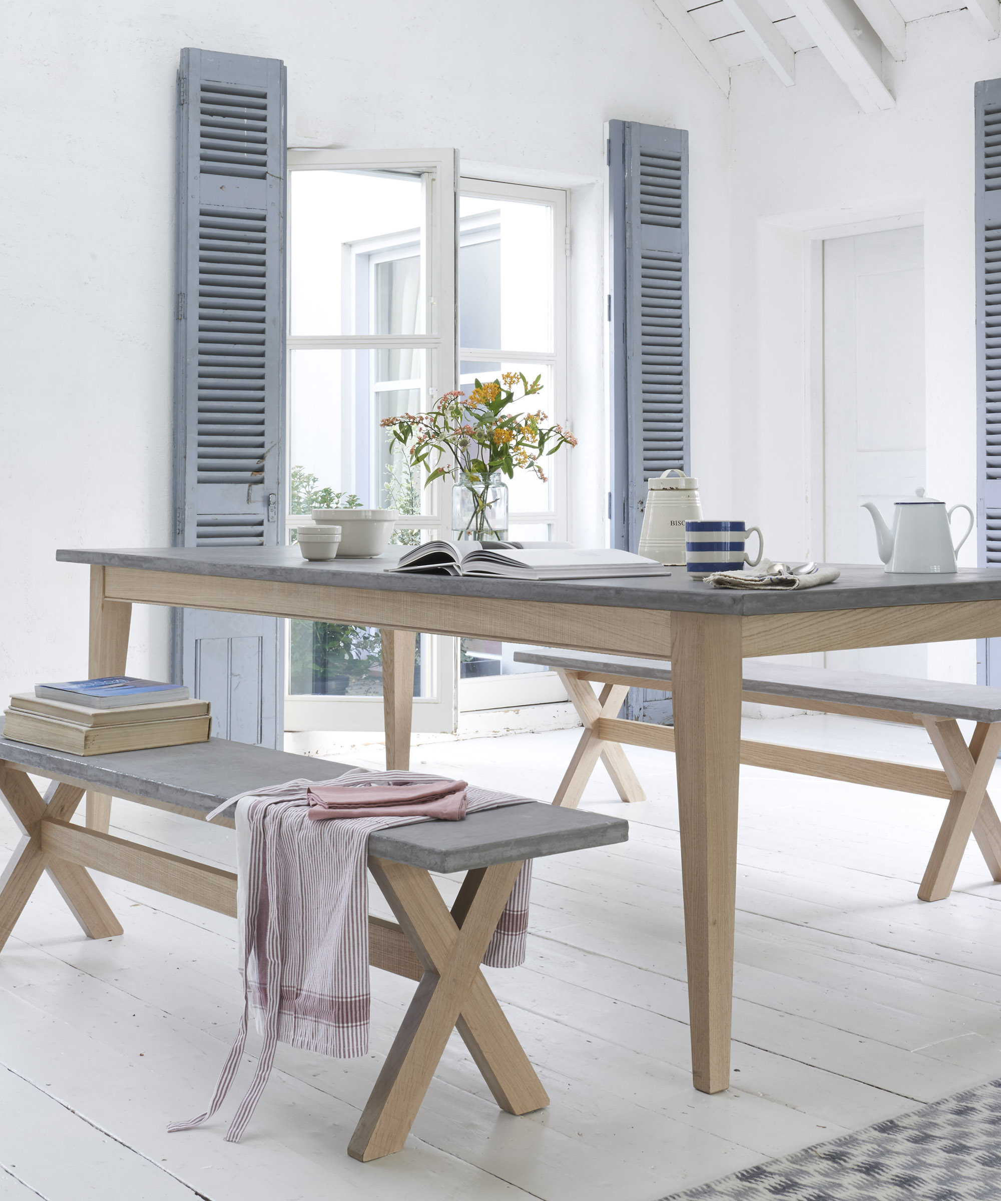 A grey faux concrete table made of wood and resin