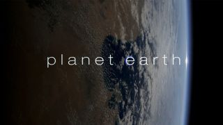 The opening title card reading "Planet Earth" with the plane behind it. 