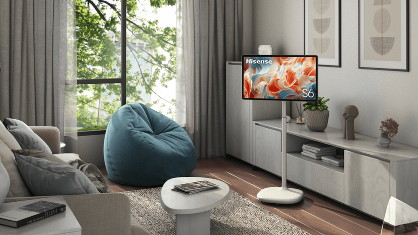 Hisense S6 FollowMe TV on its tall stand in a neutrally decorated living room