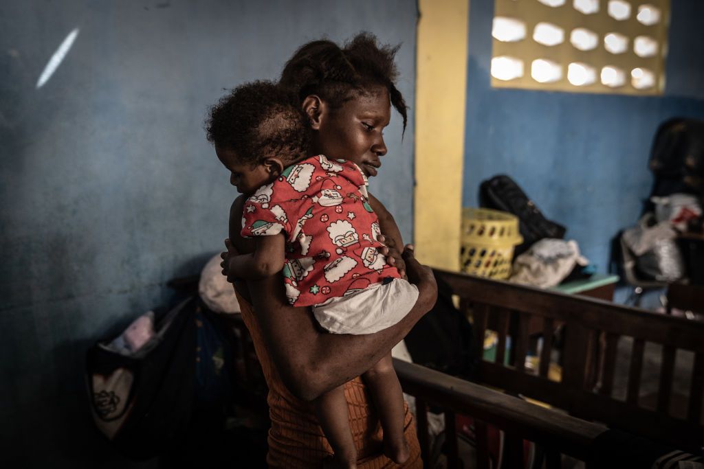 Haitian mother holding her son.