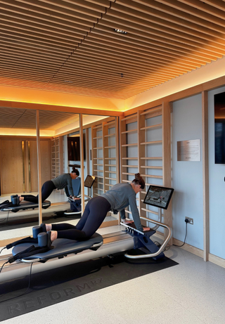 Anna during her Reform RX review and challenge on the Reformer machine