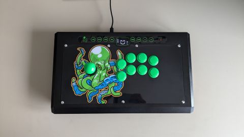 A top-down image of the Octopus Arcade Stick on a white surface