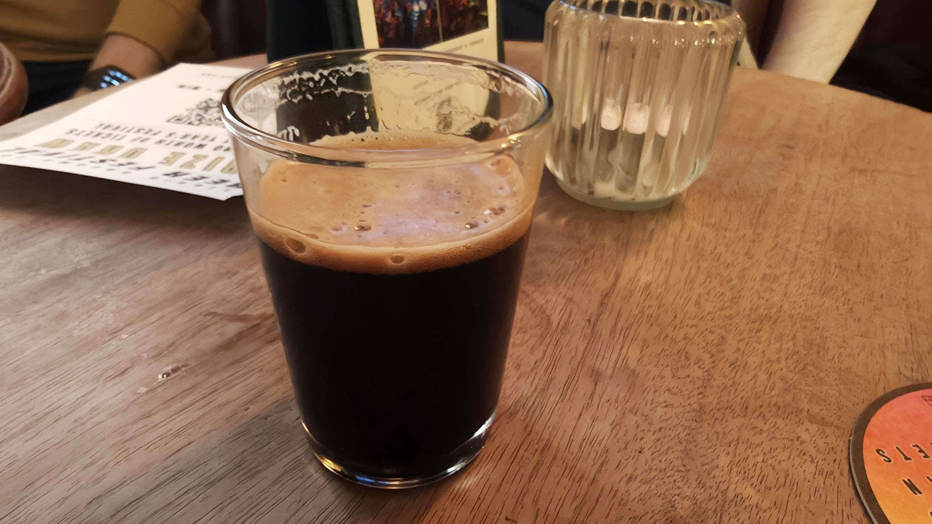 A photo of a glass of imperial stout beer.